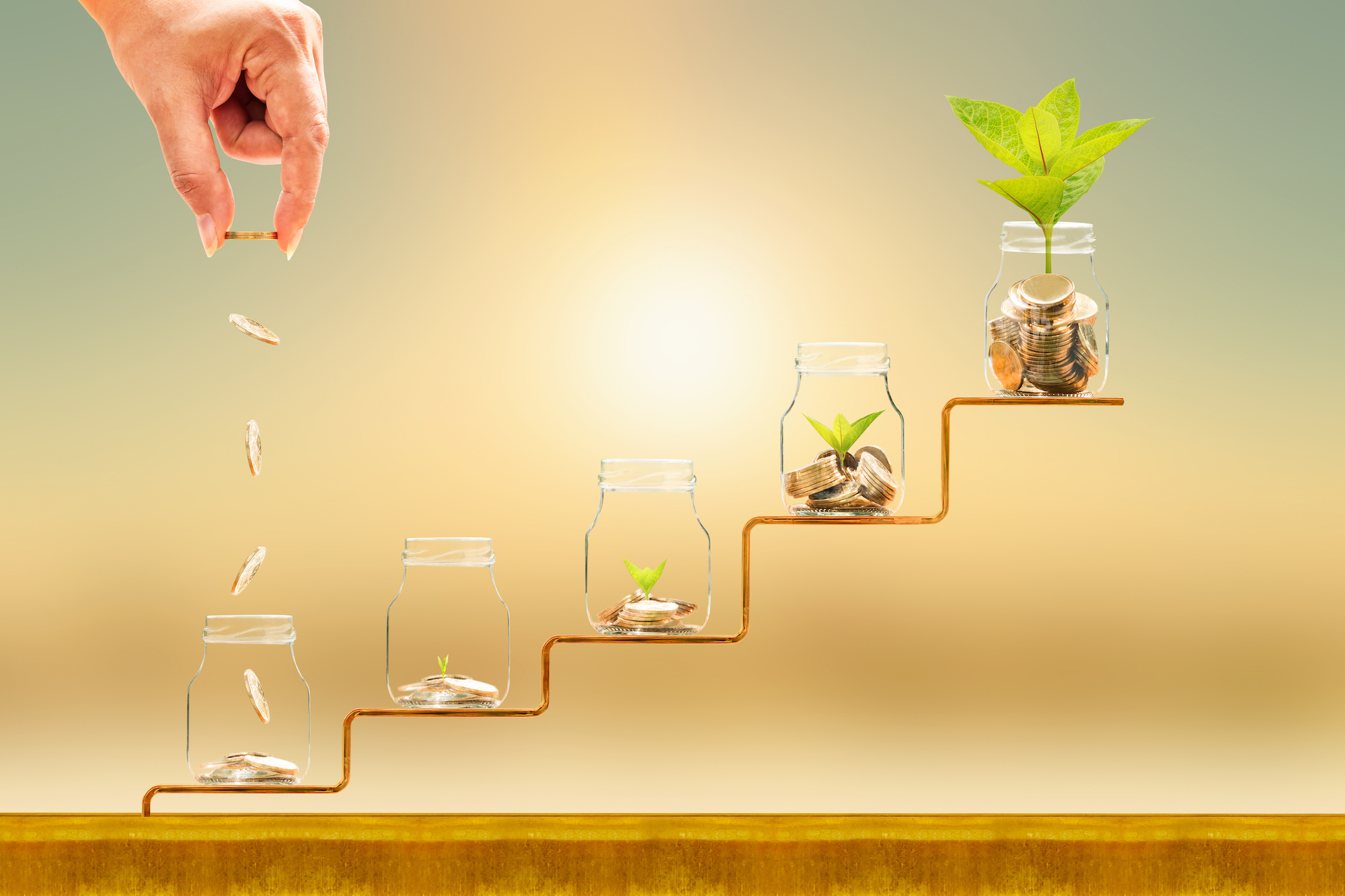 Hand dropping coins into jars with coins, increasing in height and with plants emerging